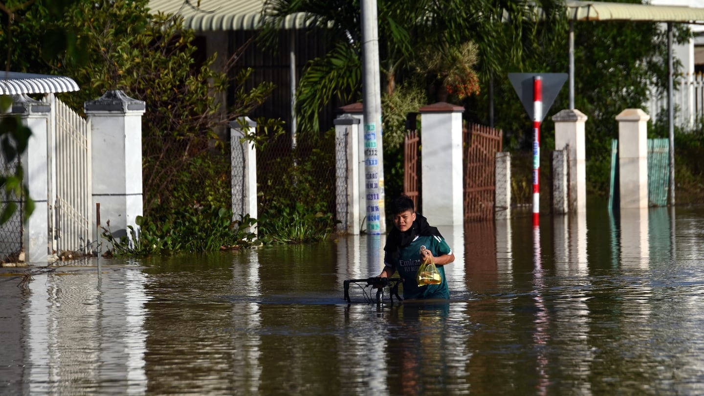 man struggling in flood